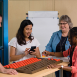 Students and professor engaging in occupational therapy techniques.